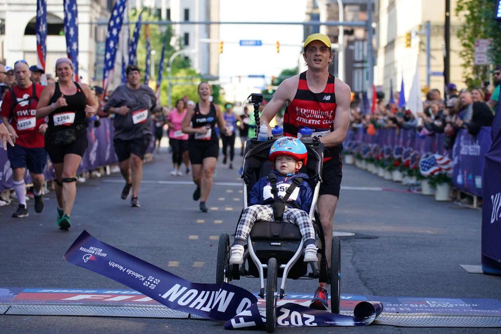 Buffalo Marathon winner pushes 2-year-old in stroller for entire race, just misses world record